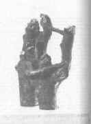 Two tree trunks entwined.